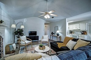 Cozy living space with a fireplace, TV, and comfortable seating options.