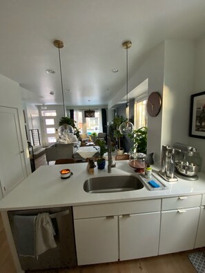 Microwave, dishwasher, coffee/tea maker, cookware/dishes/utensils