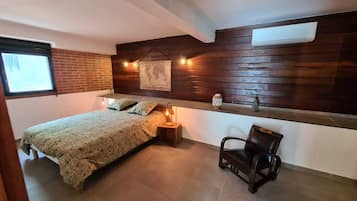 1 bedroom, desk, iron/ironing board, travel crib