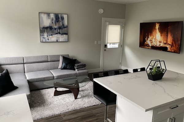 Living room with 70” TV with Premium Cable & Netflix