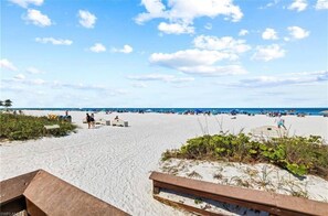 A beach with white sand and a clear blue sky. - Beautiful Beachfront Apollo 6th floor….Ocean front Tranquil Sunset Views. (Marco Island)