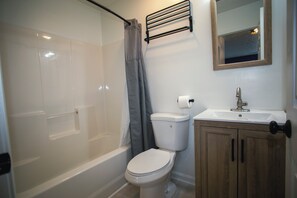 Combined shower/bathtub, hair dryer, towels, soap
