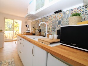 Microwave, stovetop, coffee/tea maker, toaster