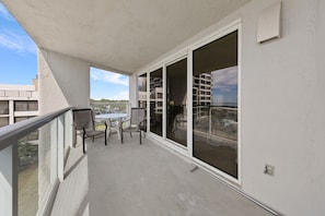 Relax on the balcony with a view of the surrounding neighborhood.