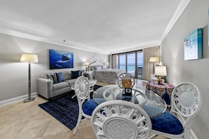 Enjoy ocean views from the large window, relax in the comfortable seating area, and unwind in this serene retreat.