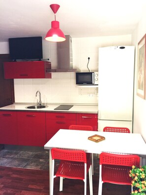 Fridge, microwave, stovetop, dining tables