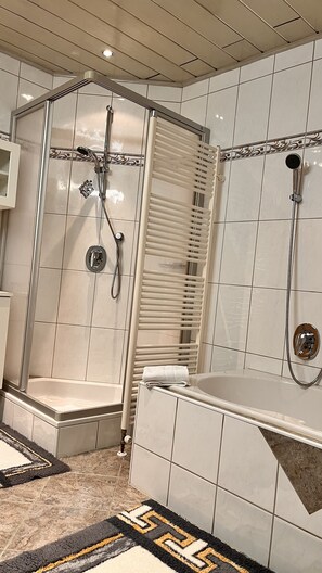 Bathtub, hair dryer, towels, soap