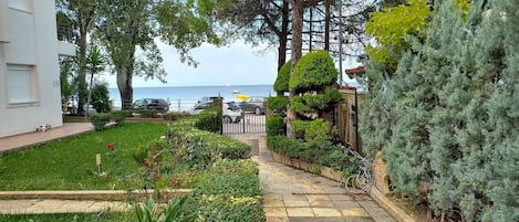Enjoy a serene garden and tranquil sea views from this property's balcony.