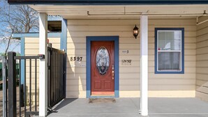 A house with a red door, a mailbox, and a number 8397 on the wall. - Cozy 1bdr/1br near downtown (Sacramento)