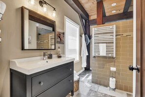 Bathtub, hair dryer, towels, soap