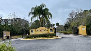 A gated entrance with a sign reading "ENCANTADA." - Only 5 minutes from Walt Disney World (Kissimmee)