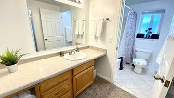 Combined shower/tub, hair dryer, towels, soap