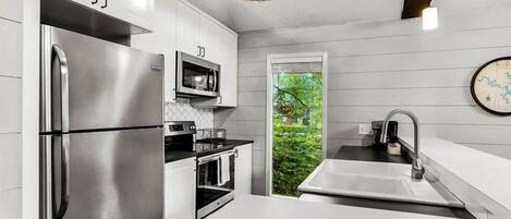 Coffee/tea maker, fridge, microwave, oven