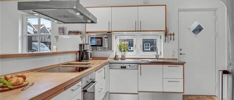 Fridge, stovetop, dishwasher, coffee/tea maker