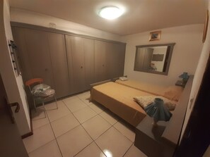 1 bedroom, desk, iron/ironing board, travel crib