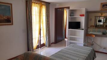 1 bedroom, desk, iron/ironing board, travel crib