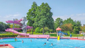 A swimming pool with multiple lanes and a water slide. - 2 bedroom amazing home in Heinkenszand (Heinkenszand)