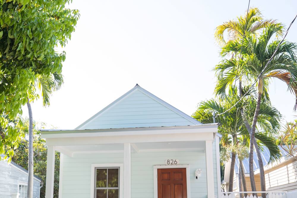 ****This property requires a minimum stay of 28 nights in the same calendar month****<br><br>***Brand New Pool with waterfall, saltwater, heater, and a chiller to maximize comfort! <br><br><br>Tropical Properties Vacation Rentals invites you to our beautiful historic home located in Historic Old Town Key West. This home is located just two blocks from Duval Street and in the center of all things Key West. This home was originally built in 1929 and has been painstakingly restored to include every modern amenity.<br><br><br>The space<br>LOCATION: This tropical destination is a two block walk from Duval Street where you will be dazzled with boutiques, restaurants, nightlife, gallery viewing, shopping and an abundance of other activities, yet the neighborhood is quiet and serene. The homes is located 5 blocks from South Beach, 8 blocks from the North Harbor, a comfortable walk or bike ride to everything Key West.<br><br>HOUSE LAYOUT: The home is boasts a gorgeous brand new front porch and new pool, with an abundance of patio furniture an outdoors oasis. This home has hard wood floors and modern tile throughout, a spacious family room, central air, washer/dryer located inside the home, a dishwasher all rarities in Key West rentals and makes this a truly enjoyable space.<br><br>BEDROOMS: This home offers 3 beautiful bedrooms with 2 full bathrooms. Every bedroom on the first floor has a TV, all have tropical décor, new linens and comforters.<br>The first floor features 2 bedrooms. The first bedroom boasts a queen bed, dresser, two night tables and a large closet. The second bedroom also has a queen bed, two night tables and large closet. The living room included a brand new sofa queen sleeper<br>The second floor is a loft accessed by stairs as shown in the photographs with a ceiling height of 5\'2" and has two twin beds, 2 dressers, night stands, and a clothes rack.<br><br>COMMON AREAS: The kitchen contains all brand new top of the line appliances, a refrigerator with an ice-maker, microwave and dishwasher. The dining area contains a comfortable configuration.<br><br>PETS: No pets are allowed in this home, this is NOT pet friendly.<br><br>PARKING: There is designated parking space on property for two FULL SIZE vehicles, an absolute rarity in Key West.<br><br>OUTDOOR AMENITIES: The tropical outdoor space is furnished with several seating areas both in the sunshine and shade. The back of the home offers a quiet respite from the hustle and bustle of nearby Duval Street.<br>Security cameras are installed on the exterior of the house. Front door, side alley, and facing backyard/pool. <br><br>OTHER AMENITIES: Iron & Ironing Board, 2 x Hair Dryers, Bed Linens, Towels, Beach Towels, Washing Machine, 3 x TV\'s, Washer dryer, Dryer, Garden (Private), Ceiling Fans, 2 x showers, high speed internet connection, air conditioning, 2x Fire Extinguishers<br>Kitchen stove, Refrigerator ,Cookware & Kitchen Utensils, Dishwasher, Microwave, Toaster, Keurig, Blender and BBQ grill and utensils.<br><br>***Guests must be 25 years of age or older unless accompanied by an adult.<br><br>****This property requires a minimum stay of 28 nights in the same calendar month**** TROPICAL PROPERTIES VACATION RENTAL - KEY WEST