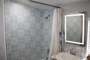 Combined shower/tub, hair dryer, towels, soap