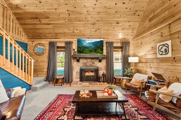 Smart TV, fireplace, table football, books