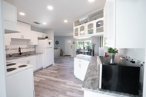 Bright Waterfront Home with Pool. Short drive to Beach. Beautiful Sunsets.