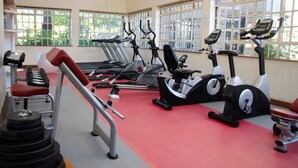 A gym with treadmills, stationary bikes, and weight machines. - Kusyombunguo Hotel Lukenya (Athi River)