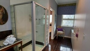A bathroom with a glass shower enclosure, a towel rack, a chair, and a window with blinds. - Platinum Suite With Private Terrace! For 2 Guests - Roosboom Luxury Apartment (Cape Town)