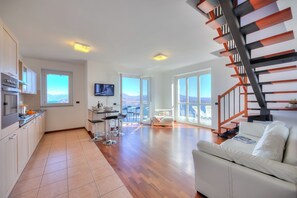 Family Apartment, Multiple Bedrooms, 2 Bathrooms, Mountainside (Penthouse The Magnifique View) | Living area | 21-inch flat-screen TV with digital channels, TV