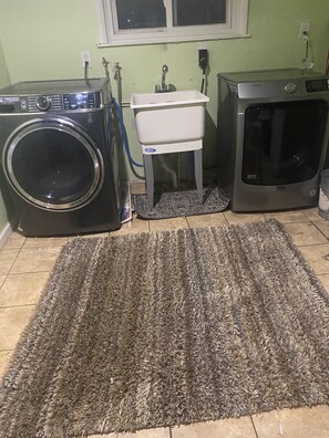 Convenient laundry area with a washing machine and dryer.