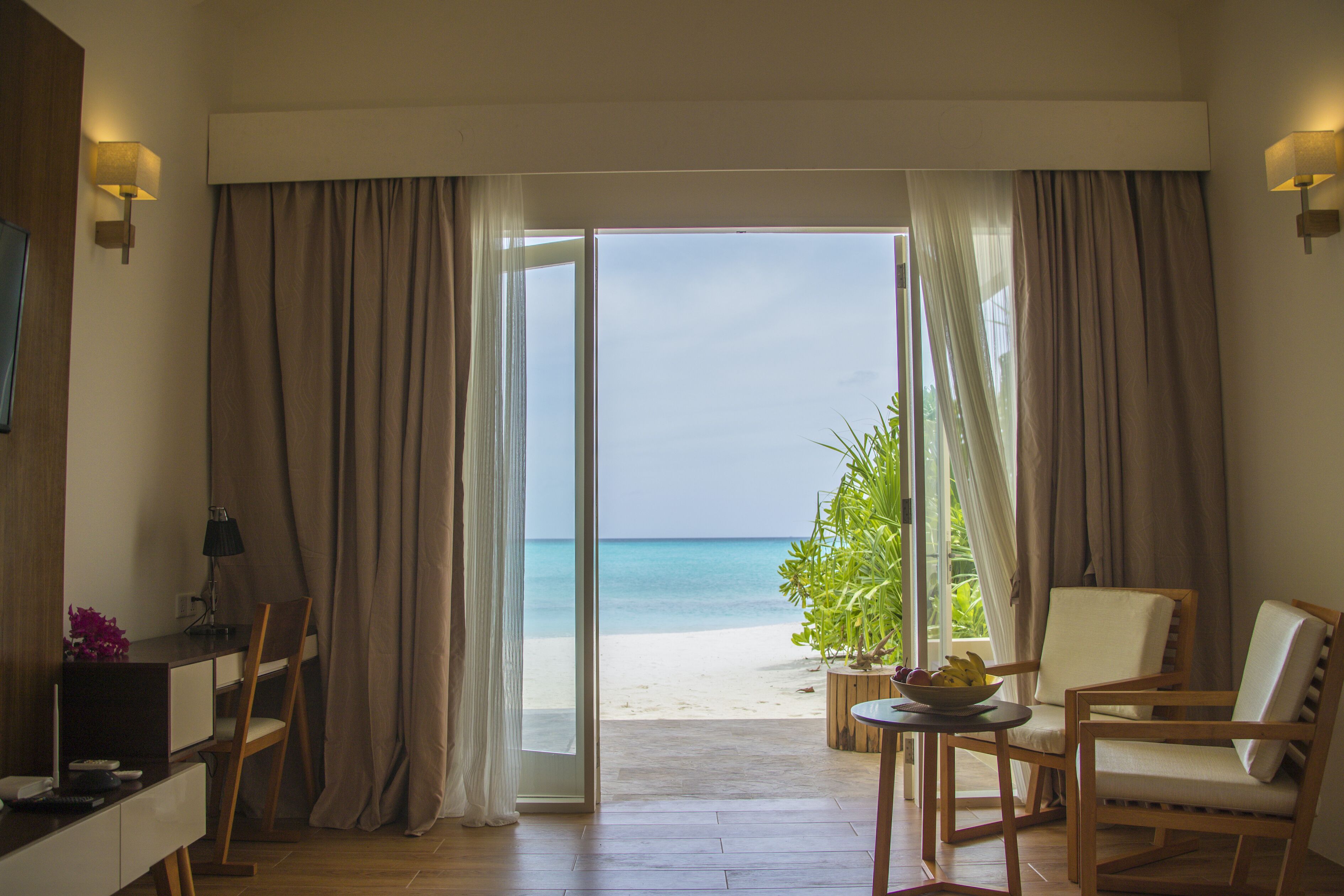 Superior Beach Bungalow | Minibar, in-room safe, desk, laptop workspace