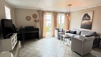 Basic Apartment | Living area | 25-inch flat-screen TV with digital channels, TV, streaming services