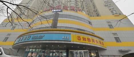 A multi-story building with signage for HAO Bank and KEB.