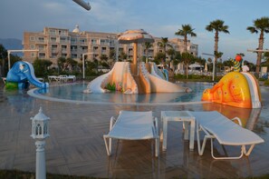 Seasonal outdoor pool, open 10:00 AM to noon, pool umbrellas