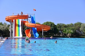Seasonal outdoor pool, open 10:00 AM to noon, pool umbrellas