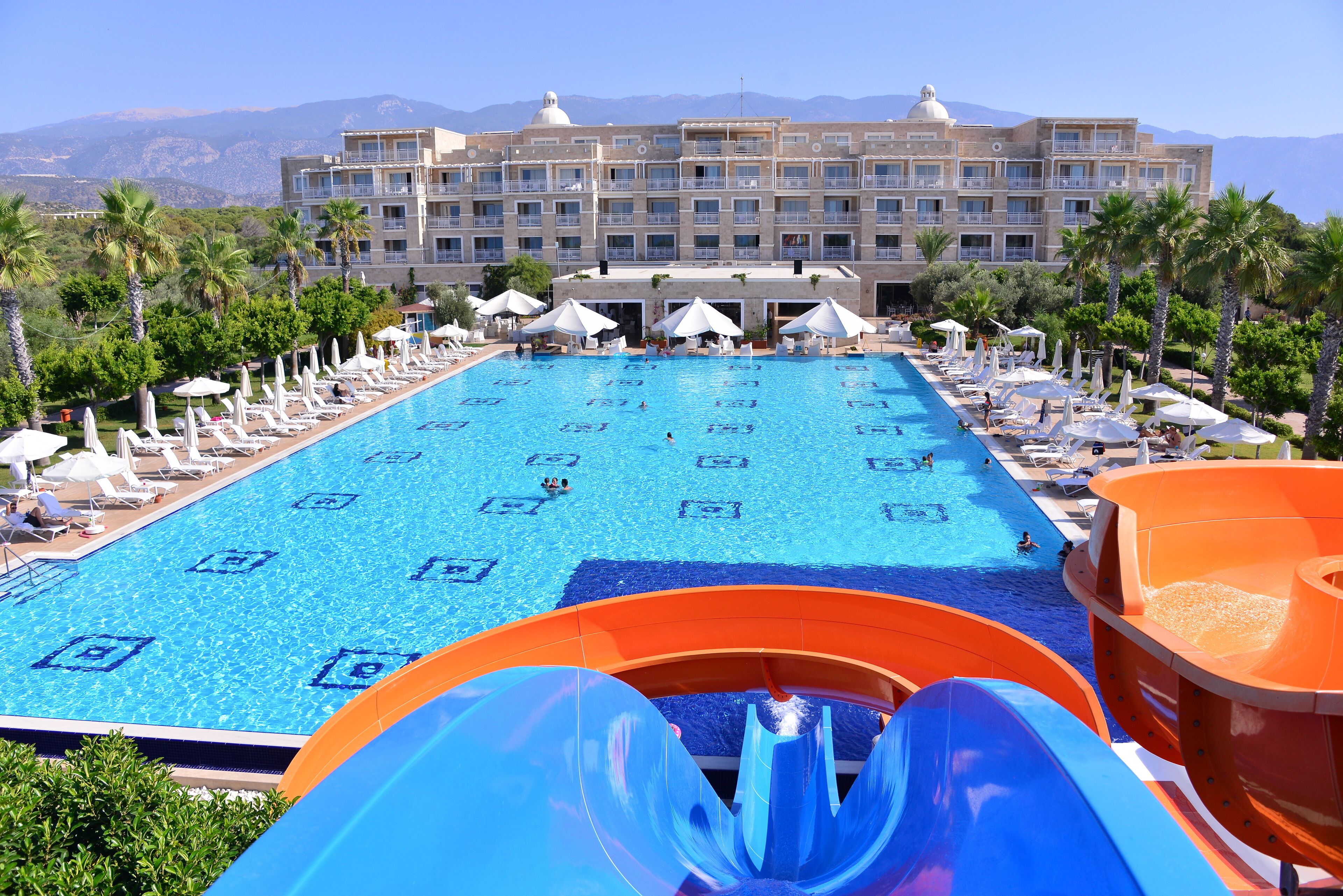 Seasonal outdoor pool, open 10:00 AM to noon, pool umbrellas