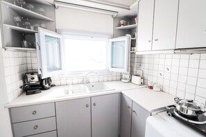 Fridge, microwave, stovetop, coffee/tea maker