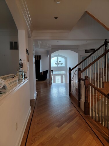 Large custom Home with ocean view, roof top deck, off street parking.