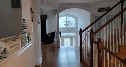 Large custom Home with ocean view, roof top deck, off street parking.