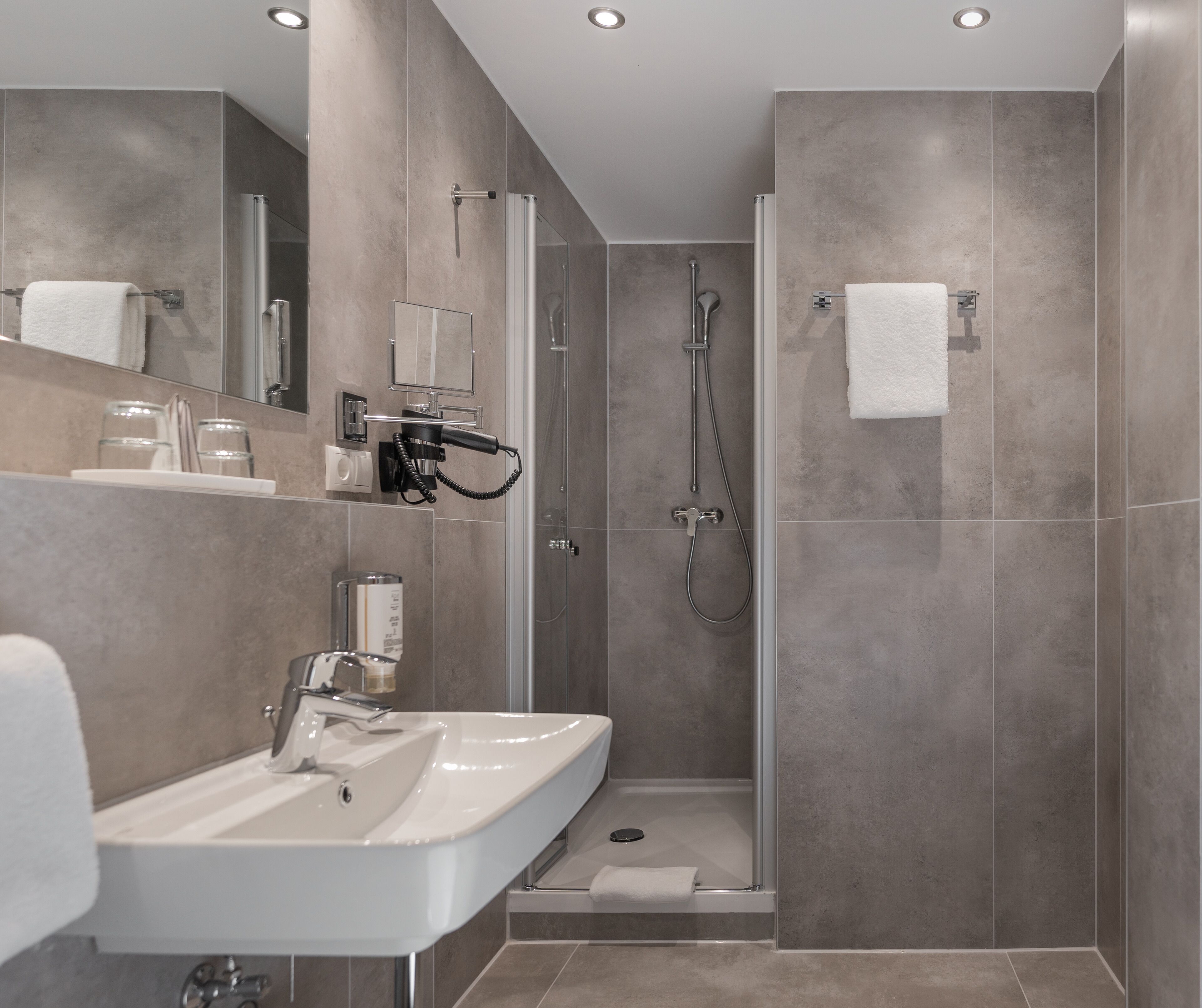 shower, free toiletries, hair dryer, towels