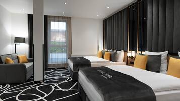 Hypo-allergenic bedding, down duvets, in-room safe, desk