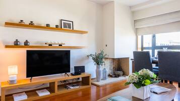 Apartment, 1 Bedroom | Living area | 50-cm flat-screen TV with cable channels, TV