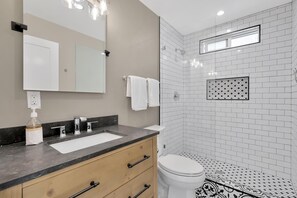 Bathtub, hair dryer, towels, soap