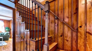 A wooden staircase with metal railings and a wooden wall. - Lakefront - King - W&D - PetsOK - Kayaks - SUPs (Coventry)