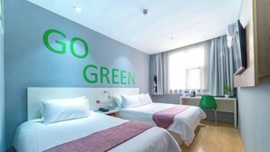 A hotel room with two beds, a TV, a desk, and a window with curtains. - Home Inn Huayi Hotel (Foshan Daliang Huagai Road Pedestrian Street Qinghuiyuan Branch) (Foshan)