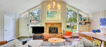 Charming shingled home surrounded by beautiful landscaping and nature,...