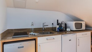 Fridge, microwave, stovetop, coffee/tea maker