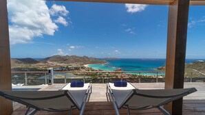 A balcony with two lounge chairs facing a coastal view. - W View (1/4 Rooms) Luxury villa (Saint Jean)