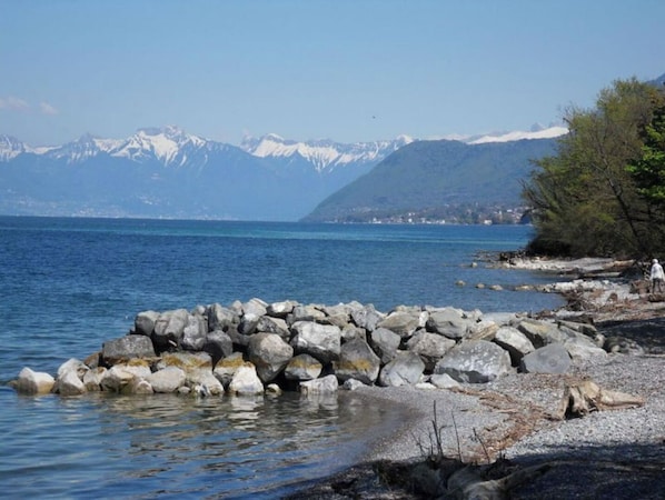 Surrounded by serene lakeside tranquility and majestic mountain vistas.