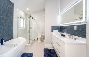 Bathtub, jetted bath, hair dryer, towels