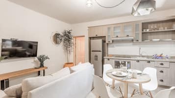 Standard Apartment, 2 Bedrooms, 2 Bathrooms, Ground Floor | Living area | 55-inch TV with digital channels
